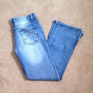 Women's Soft Blue Flare Jeans W/ Button Details